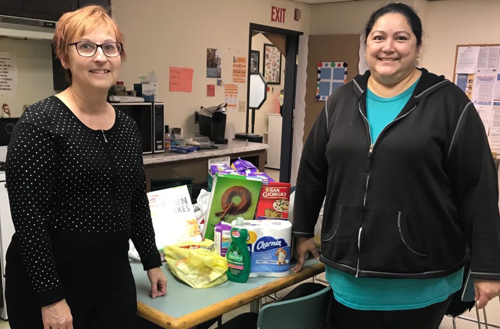 1st Ed rep and SCCAP rep pose for picture with donated items.