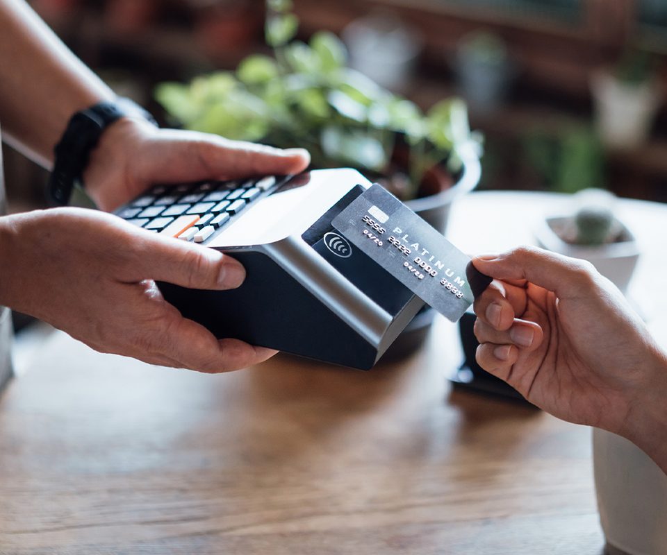 Close up of person making a purchase with a credit card