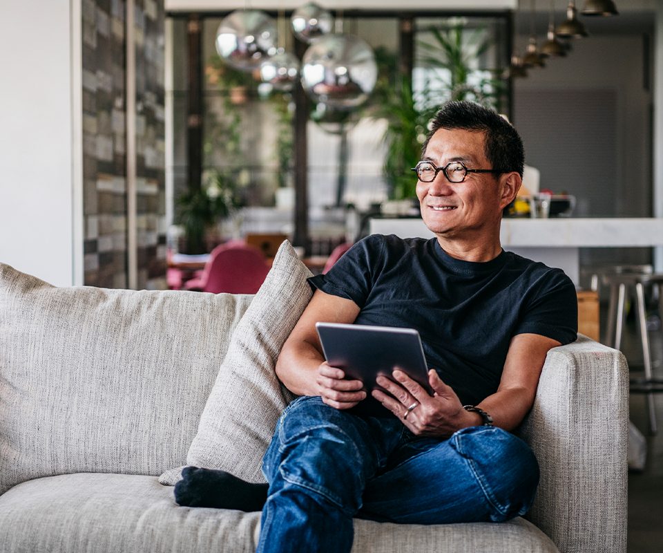 Middle aged man holding planner notebook