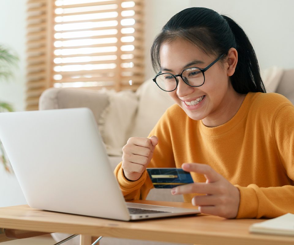 Young girl smiling while shopping online